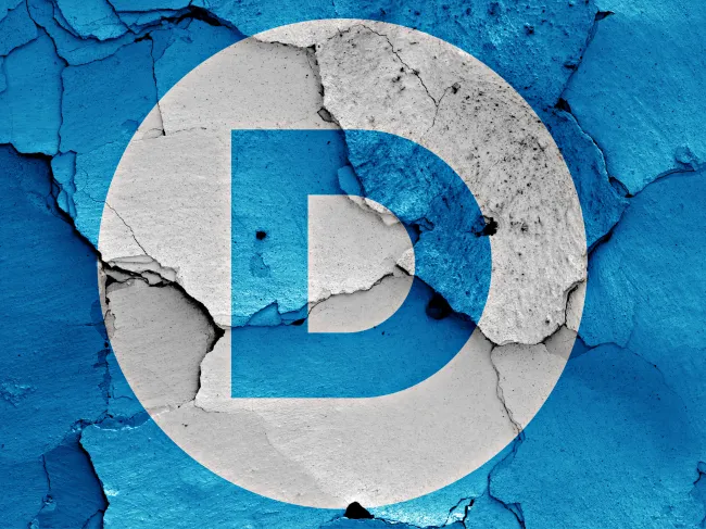 The Democratic Party flag on a cracked wall